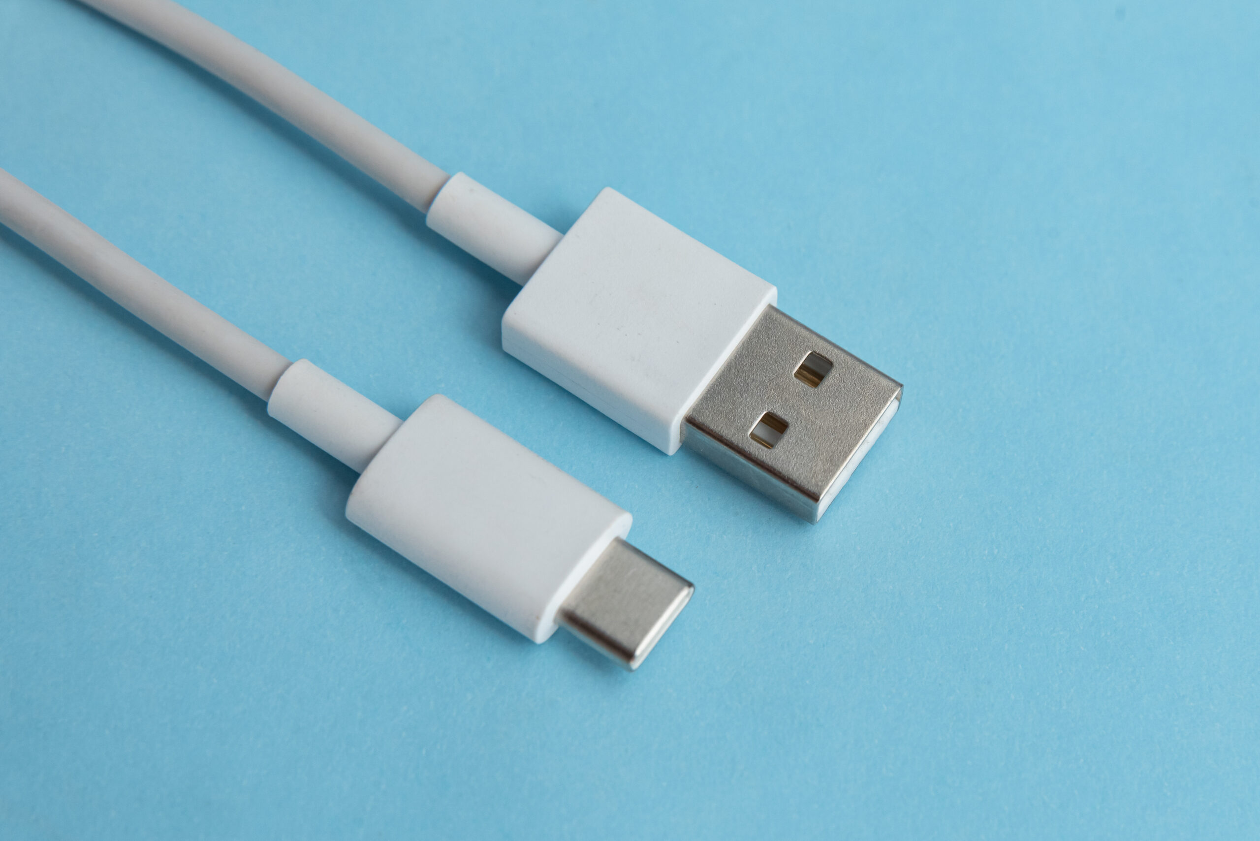 USB cable type C over blue background